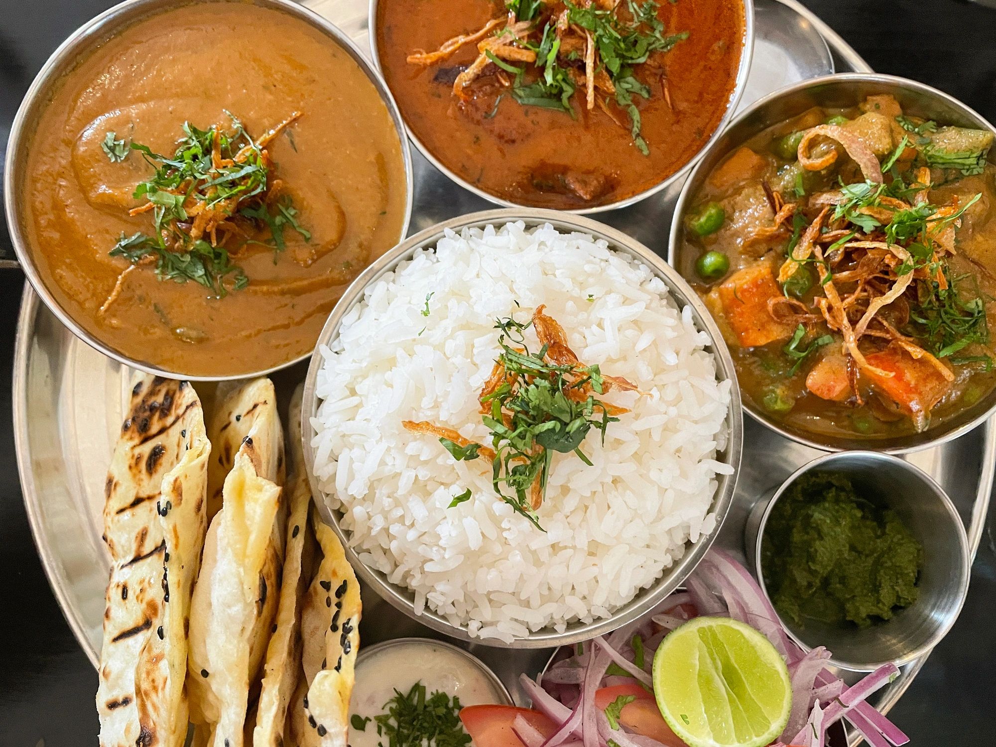 Assorted South Asian-style dishes served family-style