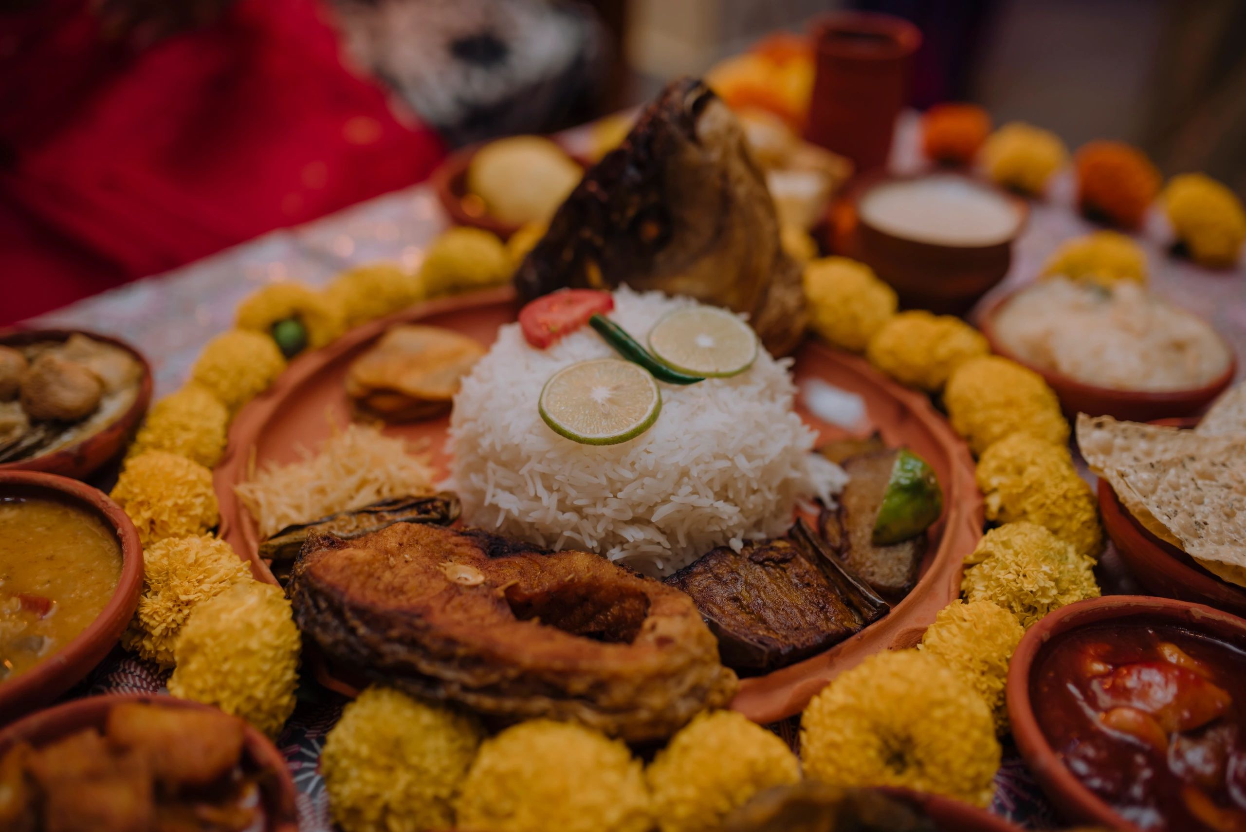 Traditional South Asian thali-style meal arrangement on a table