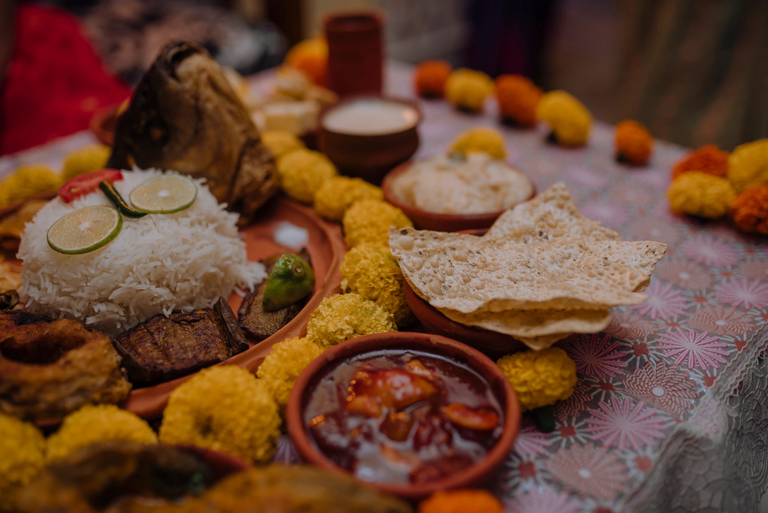 South Asian-style thali arrangement with multiple small dishes, overhead view